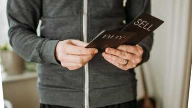 a person holding a cell phone in their hands