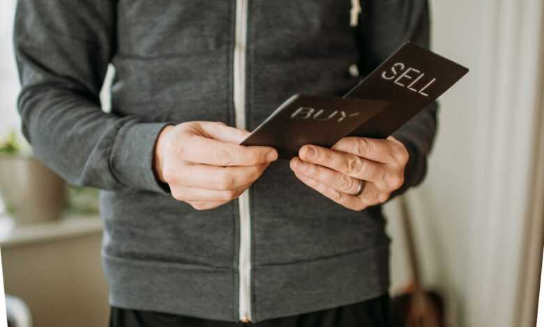 a person holding a cell phone in their hands