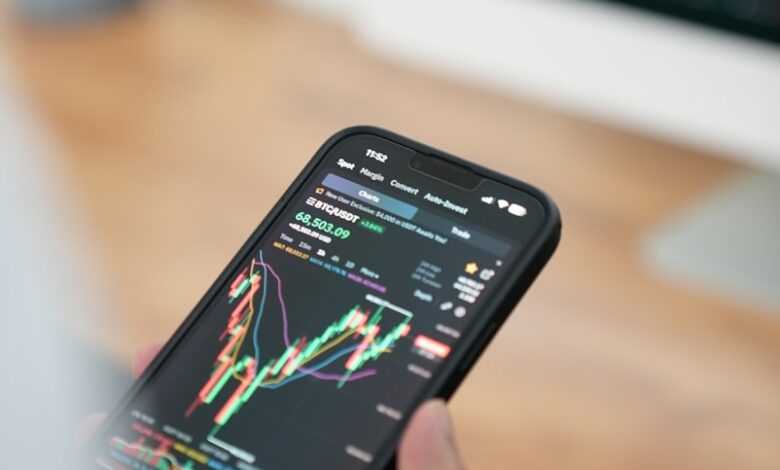 a person holding a cell phone in their hand