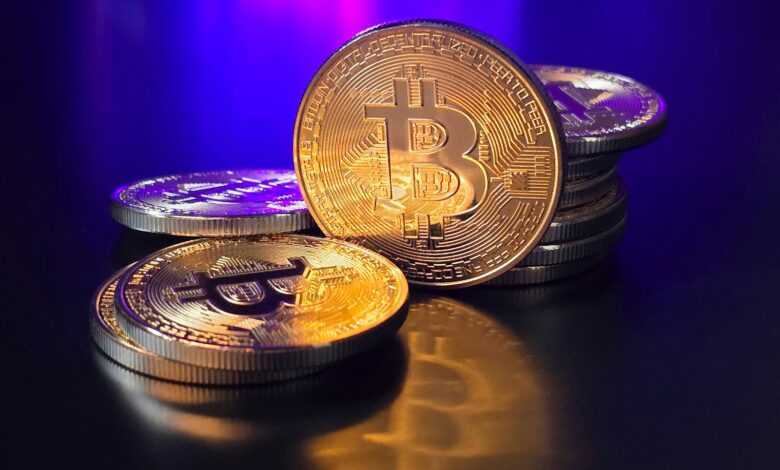 a pile of bitcoins sitting on top of a table