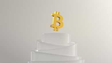 a gold crown on a stack of white paper