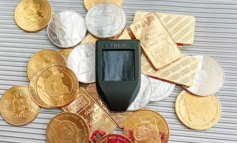 a cell phone sitting on top of a pile of coins