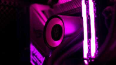 a close up of a computer with purple lights