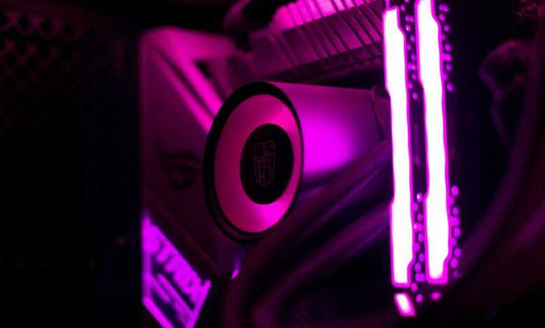 a close up of a computer with purple lights