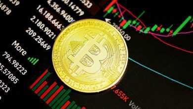 gold round coin on black surface