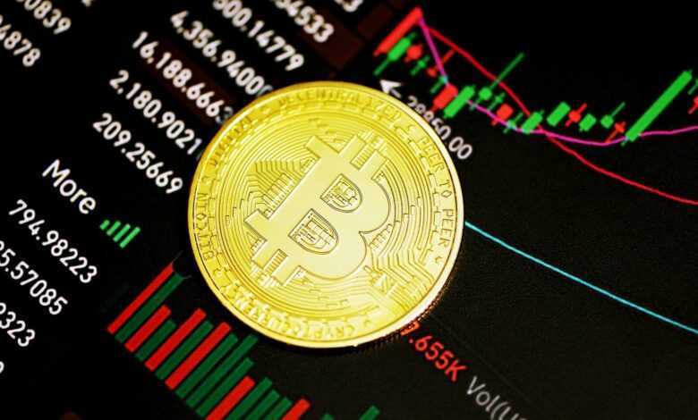 gold round coin on black surface