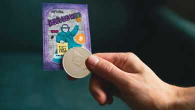 a person holding a coin in their hand