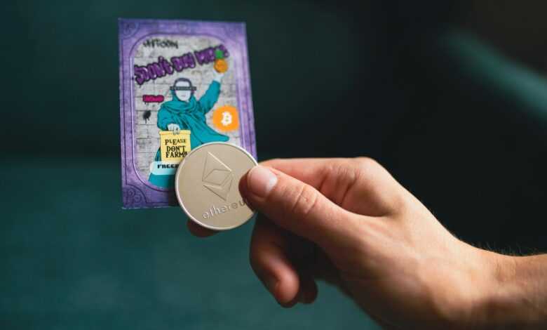 a person holding a coin in their hand