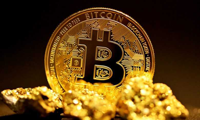 a bitcoin sitting on top of a pile of gold nuggets