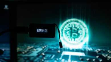 a bitcoin lit up on a computer screen