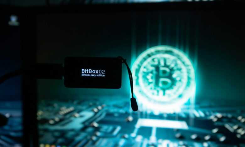 a bitcoin lit up on a computer screen