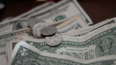 photo of dollar coins and banknotes