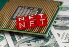 a close up of a small red block on top of a pile of money